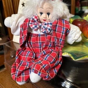 Vibrant Red and Blue Clown Doll with Ruffled Collar